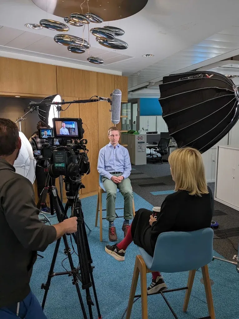 A Steadyhand interview shoot: camera, monitor, lighting and an interviewer with the contributor