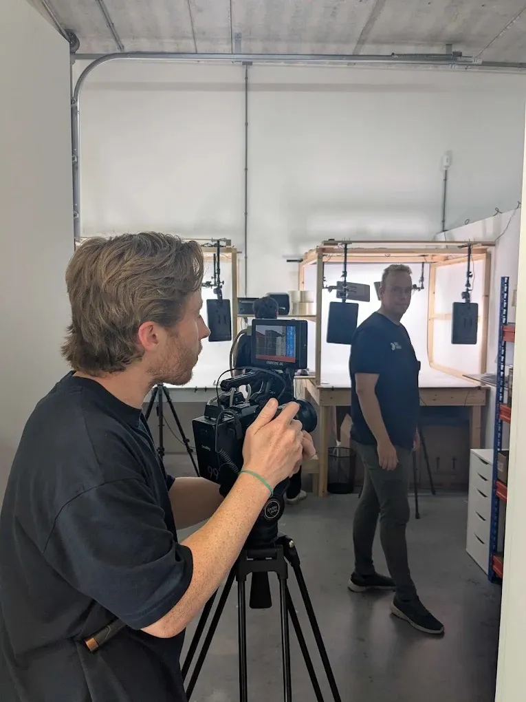 Josh filming in a workshop